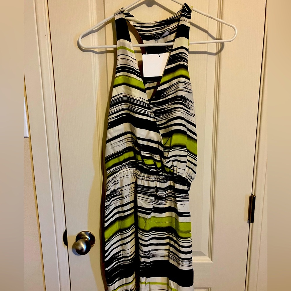 Cute summer dress with elastic waist. V neck, sleeveless. New. Size Small.
